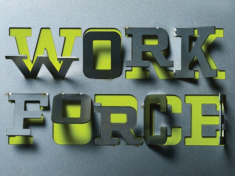 A stencil cut out of the words "Work Force."