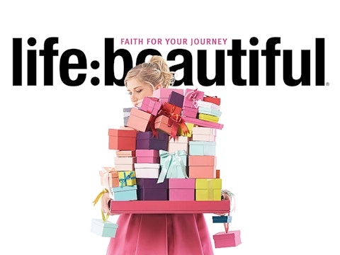 A woman holding a stack of brightly colored gift boxes for Life:Beautiful magazine.