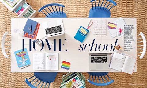 A spread of a story of home schooling from Life:Beautiful magazine, featuring a table filled with various school supplies.