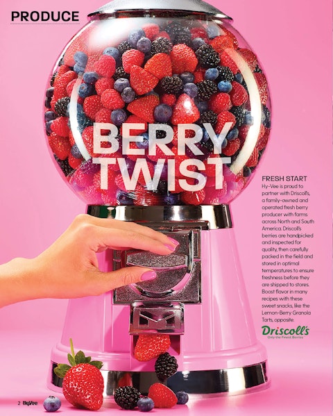 A spread of a berry story from Hy-Vee Mega Ad magazine, featuring a candy machine filled with raspberries, strawberries, and blueberries.