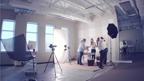 Grey Dog Media employees working on the set of a photo shoot.